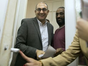 Presidential candidate Khaled Ali arrives for a press conference at his office in Cairo, Egypt, Wednesday, Jan. 17, 2018. Ali's election campaign complains of harassment and bureaucracy facing supporters who are processing the 25,000 "recommendations" stipulated for in the constitution to allow hopefuls to qualify as candidates.