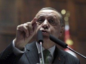 Turkey's President Recep Tayyip Erdogan addresses his lawmakers at the parliament in Ankara, Turkey, Tuesday, Jan. 16, 2018. Erdogan on Tuesday called on NATO to take a stance against the United States, a fellow ally, over its plans to form a 30,000-strong Kurdish-led border security force in Syria. Turkey has been threatening to launch a new military offensive in Syria against Syrian Kurdish militias, which Turkey considers to be terrorists because of their affiliation with outlawed Kurdish rebels fighting Turkey.