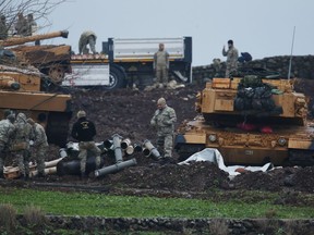 Turkish soldiers prepare their tanks to enter combat and join a military offensive on a Kurdish-held enclave in northern Syria, at a staging area in the Hatay province,Turkey near the the border with Syria.Turkey launched an operation, codenamed Olive Branch, last week against the Syrian Kurdish People's Protection Units in Afrin, Syria that it deems a terror group. The operation codenamed Olive Branch is on its fourth day.