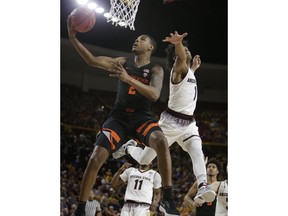 Oregon State guard Ronnie Stacy (2) drives past Arizona State guard Remy Martin during the first half of an NCAA college basketball game Saturday, Jan. 13, 2018, in Tempe, Ariz.