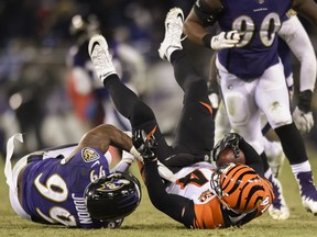Baltimore Ravens outside linebacker Matt Judon (99) sacks Cincinnati Bengals quarterback Andy Dalton (14) during the second half of an NFL football game in Baltimore, Sunday, Dec 31, 2017. The Begals defeated the Ravens 31-27.
