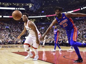 Toronto Raptors guard Kyle Lowry (left) chases a loose ball against the Detroit Pistons on Jan. 17.