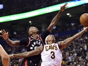 Cleveland Cavaliers guard Isaiah Thomas goes up for a basket as Toronto Raptors guard Delon Wright defends in Toronto on Thursday.