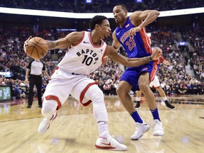 Raptors guard DeMar DeRozan looks to get around Detroit Pistons guard Avery Bradley as he defends during first half NBA action in Toronto on Wednesday night.