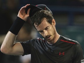 FILE - In this Friday, Dec. 29, 2017, file photo, Great Britain's Andy Murray reacts after he lost a match to Spain's Roberto Bautista Agut during the second day of the Mubadala World Tennis Championship in Abu Dhabi, United Arab Emirates. Murray has withdrawn from the Brisbane International because of a problem with his right hip. The former No. 1-ranked Murray had been scheduled to play his first match on Thursday, but notified organizers he was pulling out after failing to practice on Tuesday.