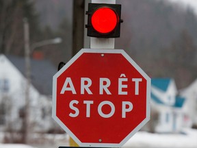A stop sign at the Quebec border with the United States. In the past three years, the U.S. has opened 11 investigations into Canadian exports including aircraft, newsprint and softwood lumber, compared with two investigations in the entire decade before that.