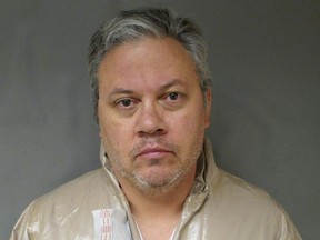 FILE - This Sept. 12, 2017, file booking photo provided by the Lebanon Police Department shows Travis Frink, charged with first-degree murder in the death of his 70-year-old mother, Pamela Ferriere, shot to death in the intensive care unit at Dartmouth-Hitchcock Medical Center in Lebanon, N.H. A preliminary hearing is set for Monday, Jan. 22, 2018,  for Frink of Warwick, Rhode Island. (Lebanon Police Department via AP, File)