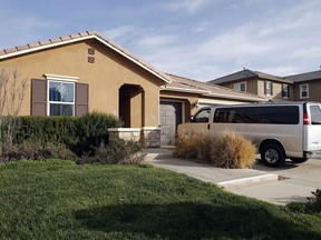 This photo shows the exterior of the home where police arrested a couple accused of holding their 13 children captive, in Perris, Calif., Tuesday, Jan. 16, 2018. Authorities said an emaciated teenager led deputies to the California home where her 12 brothers and sisters were locked up in filthy conditions, with some of them malnourished and chained to beds.