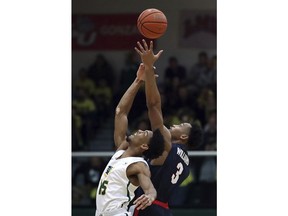 Gonzaga's Johnathan Williams, right, and San Francisco's Nate Renfro reach for the ball during the first half of an NCAA college basketball game Saturday, Jan. 13, 2018, in San Francisco.