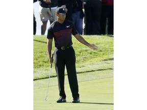 Tiger Woods reacts after making a bogey on the first hole of the South Course at Torrey Pines Golf Course during the first round of the Farmers Insurance Open golf tournament Thursday, Jan. 25, 2018 in San Diego, Calif.