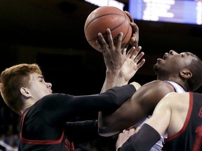 UCLA guard Prince Ali, right, is fouled by Stanford guard Robert Cartwright during the first half of an NCAA college basketball game in Los Angeles, Saturday, Jan. 27, 2018.
