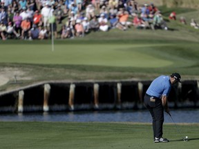 Jon Rahm hits from the fairway on the 18th hole during the second round of the CareerBuilder Challenge golf tournament on the Jack Nicklaus Tournament Course at PGA West Friday, Jan. 19, 2018 in La Quinta, Calif.