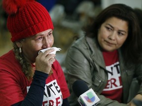 El Salvador immigrants Diana Paredes, left, and Isabel Barrera, react at a news conference following an announcement on Temporary Protected Status for nationals of El Salvador, in Los Angeles, Monday Jan. 8, 2018. The Trump administration said Monday it is ending special protections for Salvadoran immigrants, an action that could force nearly 200,000 to leave the U.S. by September 2019 or face deportation. El Salvador is the fourth country whose citizens have lost Temporary Protected Status under President Donald Trump.