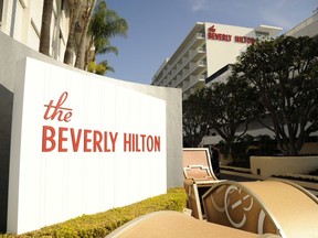 FILE - In this Jan. 8, 2015 file photo, The Beverly Hilton is pictured during the 72nd Annual Golden Globe Awards Preview Day at the Beverly Hilton in Beverly Hills, Calif. The 75th Golden Globe Awards will be handed out on Sunday, Jan. 7, 2018, at a ceremony that is being held under the cloud of the sexual misconduct scandal that started with several high-profile actresses accusing Harvey Weinstein of sexual harassment or abuse. Many actresses say they are planning to wear black Sunday to show solidarity with victims of harassment and abuse.