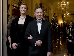 FILE - In this Dec. 8, 2013 file photo, former Rep. Dennis Kucinich, D-Ohio, and his wife Elizabeth Kucinich, arrive for a reception honoring the 2013 Kennedy Center Honors honorees, in the East Room of the White House in Washington. Kucinich is preparing to make the Democratic primary for Ohio governor a five-way race. The outspoken Democrat is set to make his announcement on Wednesday, Jan. 17, 2018, at a community center in Middleburg Heights, Ohio.