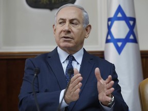 Israeli Prime Minister Benjamin Netanyahu chairs the weekly cabinet meeting at his office in Jerusalem, Sunday, Jan. 7, 2018.