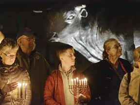 FILE - In this Dec. 11, 2015 file photo, people participate in a Jewish Voice for Peace gathering on Hanukkah to challenge Islamophobia and fight against racism, in Durham, N.C. Israel has published a list of 20 organizations from around the globe whose members are set to be denied entry for advocating for boycotts against the country including the U.S.-based Jewish Voice for Peace, which counts more than 13,000 members.