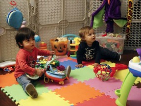 Sixteen-month-old Ethan Dvash-Banks, left, and his twin brother, Aiden, play in the living room of their apartment Tuesday, Jan. 23, 2018, in Los Angeles. The toddler twins share almost everything: the same toys, the same nursery, the clothes and the same parents. Everything but a toothbrush and U.S. citizenship. Ethan became a plaintiff in a federal lawsuit against the U.S. State Department that seeks the same rights his brother has as a citizen.