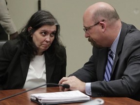 Louise Anna Turpin, left, appears in court with her attorney Jeff Moore in Riverside, Calif., Thursday, Jan. 18, 2018. Prosecutors filed 12 counts of torture, seven counts of dependent adult abuse, six counts of child abuse and 12 counts of false imprisonment against Turpin and his wife, Louise Anna Turpin. Authorities say the abuse left the children malnourished, undersized and with cognitive impairments.