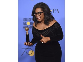 Oprah Winfrey poses in the press room with the Cecil B. DeMille Award at the 75th annual Golden Globe Awards at the Beverly Hilton Hotel on Sunday, Jan. 7, 2018, in Beverly Hills, Calif.