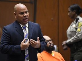 FILE - In this March 20, 2015 file photo, Attorney Matthew Fletcher, left, speaks for his client, Marion "Suge" Knight, right, in a court appearance for a bail review hearing in his murder case in Los Angeles. Authorities say the high-profile Los Angeles attorney, Fletcher, has been arrested. Los Angeles County sheriff's spokeswoman Nicole Nishida tells The Associated Press that Matthew Fletcher was arrested on a warrant Thursday, Jan. 25, 2018.
