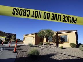 FILE - This Oct. 2, 2017 file photo shows police tape blocking off the home of Stephen Craig Paddock in Mesquite, Nev. A federal judge is being asked to unseal documents telling what federal agents learned before searching properties belonging to the gunman responsible for the Oct. 1, 2017 massacre on the Las Vegas Strip. Prosecutors aren't opposing a Friday, Jan. 12, 2018 request from media organizations for U.S. District Judge Jennifer Dorsey to release redacted affidavits underlying warrants for locations including Stephen Paddock's home in Mesquite.