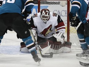 Arizona Coyotes goaltender Scott Wedgewood (31) blocks a shot at goal by the San Jose Sharks during the first period of an NHL hockey game Saturday, Jan. 13, 2018, in San Jose, Calif.