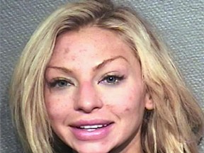 This photo provided by the Houston Police Department shows Lindy Lou Layman who was arrested Saturday, Jan. 6, 2018, on criminal mischief charges after her date with Anthony Buzbee, a prominent Houston trial lawyer. Authorities say Layman, of Dallas, was intoxicated while on a first date with Buzbee and caused at least $300,000 in damage to his art collection, including two Andy Warhol paintings. (Houston Police Department via AP)