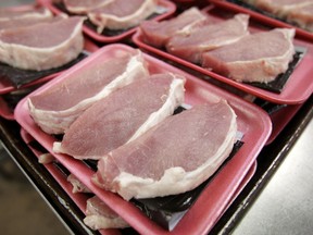 FILE - In this March 3, 2011 =, file photo, boneless pork loins sit waiting to be packaged at a grocery store in Des Moines, Iowa. Federal government regulators proposed changes Friday, Jan. 19, 2018, in the way most hogs slaughtered for meat in the United States are processed in a series of new rules that officials say improve industry practices but critics say could imperil food safety.