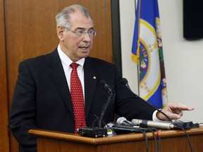 FILE - In this March 30, 2016, file photo, Hennepin County Attorney Mike Freeman speaks at a news conference in Minneapolis. Freeman has convened a grand jury in the July 2017 police shooting of Justine Ruszczyk Damond, of Australia, by Minneapolis Officer Mohamed Noor. Freeman said previously he would no longer use grand juries in police shootings, and would decide those cases himself. AP Photo/Jim Mone, File)