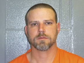 File - This Dec. 9, 2015, booking photo provided by the Custer County, Okla., Sheriff's Office shows Jeremy Doss Hardy. Hardy's murder trial began Tuesday, Jan. 16, 2018, in Arapaho, Okla. He is charged with two counts of first-degree murder, assault with a dangerous weapon and other offenses. Prosecutors are seeking the death penalty. Investigators say Hardy fired randomly at vehicles along Interstate 40 in western Oklahoma on Dec. 16, 2015.