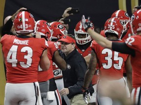 Georgia head coach Kirby Smart rallies his team before the NCAA college football playoff championship game against Alabama Monday, Jan. 8, 2018, in Atlanta.