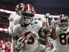 Alabama's Calvin Ridley celebrates his touchdown catch during the second half of the NCAA college football playoff championship game against Georgia Monday, Jan. 8, 2018, in Atlanta.