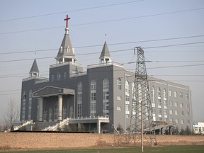 The Golden Lampstand Church in Linfen in northern China's Shanxi Province. Witnesses and overseas activists say paramilitary troops known as the People's Armed Police used excavators and dynamite on Tuesday, Jan. 9, 2018, to destroy the Golden Lampstand Church, a Christian mega-church that clashed with the government.