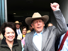 Cliven Bundy walks out of federal court with his wife Carol on Monday, Jan. 8, 2018, in Las Vegas, after a judge dismissed criminal charges against him and his sons accused of leading an armed uprising against federal authorities in 2014.