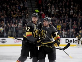 Vegas Golden Knights defencemen Shea Theodore (left) and Brad Hunt celebrate a goal against the Columbus Blue Jackets on Jan. 23.