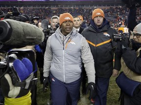 Denver Broncos coach Vance Joseph walks off the field after the team's 27-24 loss to the Kansas City Chiefs during an NFL football game Sunday, Dec. 31, 2017, in Denver.