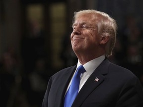 President Donald Trump smiles during State of the Union address in the House chamber of the U.S. Capitol to a joint session of Congress, in Washington on Tuesday, Jan. 30, 2018.