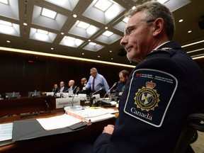 Associate Vice President Canada Border Services Agency Jacques Cloutier joins Immigration Minister Ahmed Hussen and Public Safety Minister Ralph Goodale as they appear as witnesses at a commons committee briefing in Ottawa on Thursday, Oct. 5, 2017.