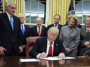 President Donald Trump signs into law the bipartisan Interdict Act to curtail opioids trafficking, during a ceremony in the Oval Office of the White House in Washington, Wednesday, Jan. 10, 2018. A fever of speculation has broken out about whether U.S. President Donald Trump might soon announce his intention to withdraw from NAFTA, as the talks enter their most sensitive phase.