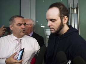 Joshua Boyle speaks to the media after arriving at the airport in Toronto on Friday, October 13, 2017. Boyle was arrested by Ottawa police late last month and made his first court appearance on New Year's Day facing 15 charges, including eight counts of assault, two of sexual assault, two of unlawful confinement and one count of causing someone to take a noxious thing.