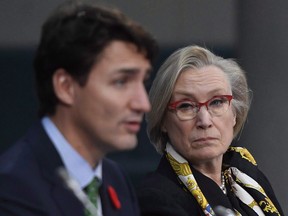 Minister of Crown-Indigenous Relations and Northern Affairs Carolyn Bennett listens as Prime Minister Justin Trudeau speaks at the Canada - Modern Treaty and Self-Governing First Nations Forum, in Ottawa on Wednesday, Nov. 1, 2017. MPs on the cocktail circuit must be cautious about alcohol consumption as Parliament Hill looks to put an end to inappropriate behaviour and tackle sexual misconduct, says Crown-Indigenous Relations Minister Carolyn Bennett.