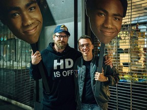 Andy Hines, left, is shown on set of "Black Spider-Man" music video with Logic in Los Angeles in this undated handout image. Nova Scotian director Andy Hines still gets emotionally overwhelmed remembering the day his Grammy-nominated music video "1-800-273-8255" went online last summer.