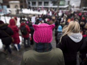 A minister in Alberta's NDP government has chastised a tweet by the Opposition's communications chair that slammed women's marches held over the weekend. A woman wears a pink "pussy hat" while joining the Women's March in solidarity with women and human rights groups across the world in Halifax on Saturday, January 20, 2018.