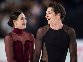 Tessa Virtue and Scott Moir skate off the ice after performing their free dance during the senior ice dance competition at the Canadian Figure Skating Championships in Vancouver, B.C., on Saturday January 13, 2018. Virtue and Moir will carry Canada's flag into the opening ceremony at next month's Winter Games in South Korea.