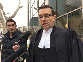 Defence lawyer Mike Cook speaks to reporters outside the Winnipeg courthouse after his client Ron Siwicki, pleaded guilty to criminal negligence causing death on Monday Jan. 22, 2018. Court heard Siwicki left his injured mother to die on the floor of the home they shared.
