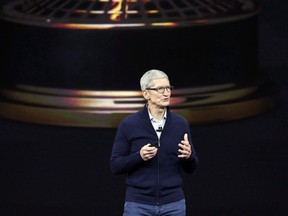 Apple CEO Tim Cook, shows new Apple Watch Series 3 product at the Steve Jobs Theater on the new Apple campus on Tuesday, Sept. 12, 2017, in Cupertino, Calif. Apple chief executive Tim Cook is visiting Canada for the first time, making a surprise drop-in for Toronto students to promote the company's initiative to focus on coding education.THE CANADIAN PRESS/AP, Marcio Jose Sanchez