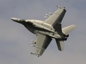 The Boeing F-18 Super Hornet jet fighter performs a demonstration flight at the Bourget airport, during the 47th Paris Air Show in Le Bourget, north of Paris, Tuesday June 19, 2007. Boeing says it has not decided whether to submit its Super Hornet fighter jet as a potential replacement for Canada's aging CF-18s, as it waits to see how the federal government will run the multi-billion-dollar competition.