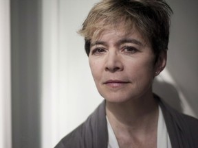 Author Ann-Marie MacDonald poses for a portrait in Toronto as she promotes her new book "Adult Onset" on Thursday, Sept. 25, 2014. Acclaimed writer Ann-Marie MacDonald says leaders at the Soulpepper Theatre Company "bullied and harassed" her after she raised concerns about a fundraiser that auctioned dinners with a cast of actresses.