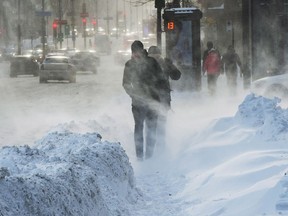 Pedestrians battle the blowing snow and wind chills in the -30C range, Friday, January 5, 2018 in Montreal. As many Canadians shivered through the country's widespread, brutal cold snap in recent weeks, anyone on the Conservative Party of Canada's fundraising list may have felt they had more to make them shudder.THE CANADIAN PRESS/Ryan Remiorz